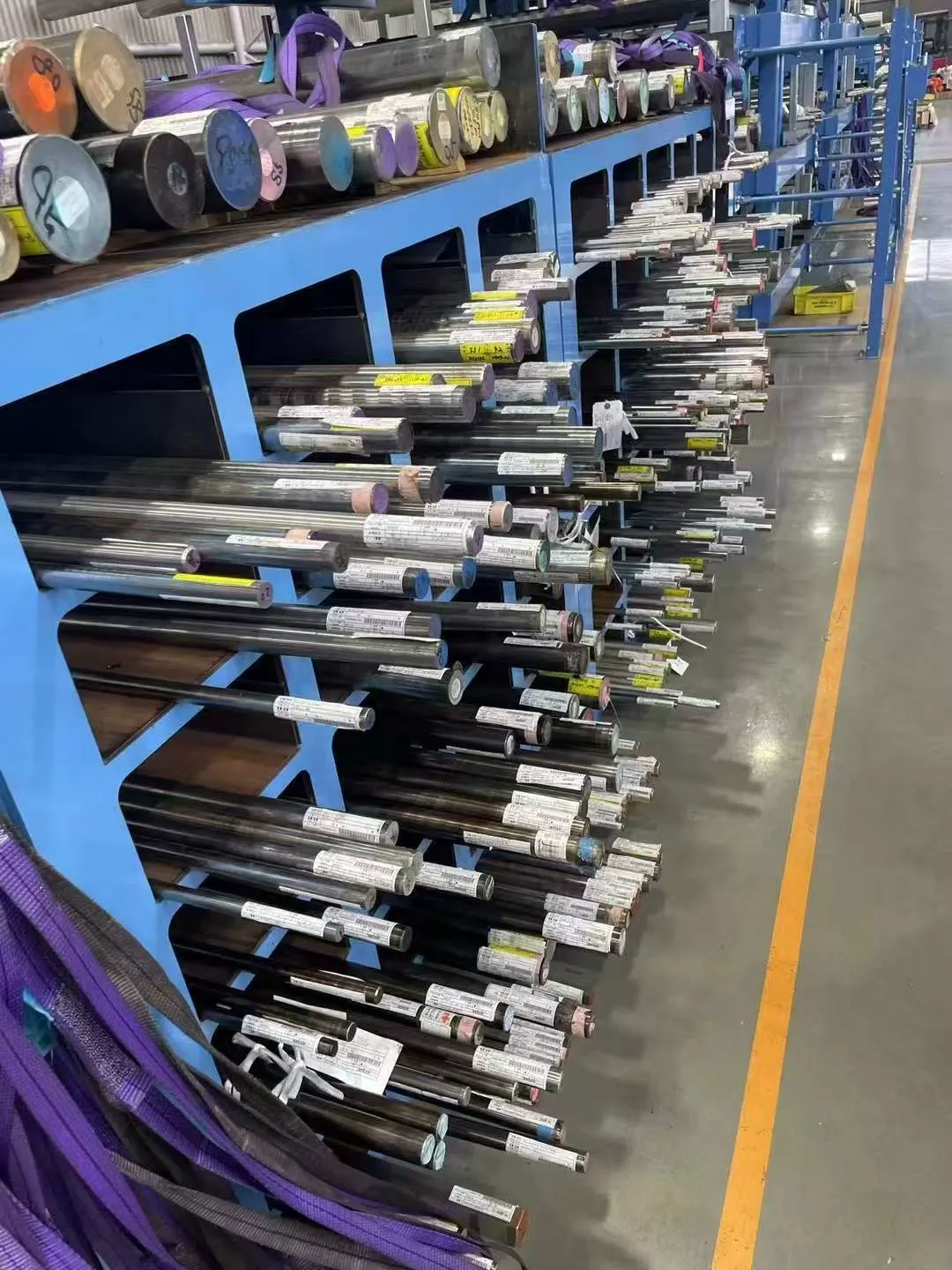 Nickel alloy bars arranged by diameter with identification labels