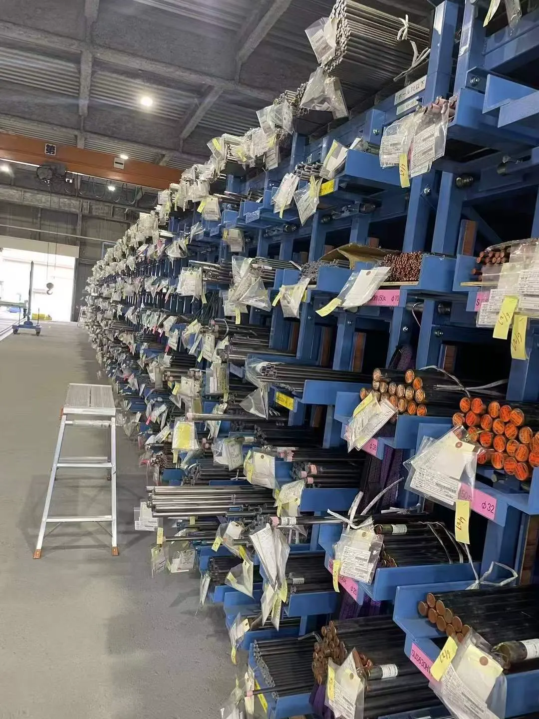 Long alloy bar storage racks with material tags