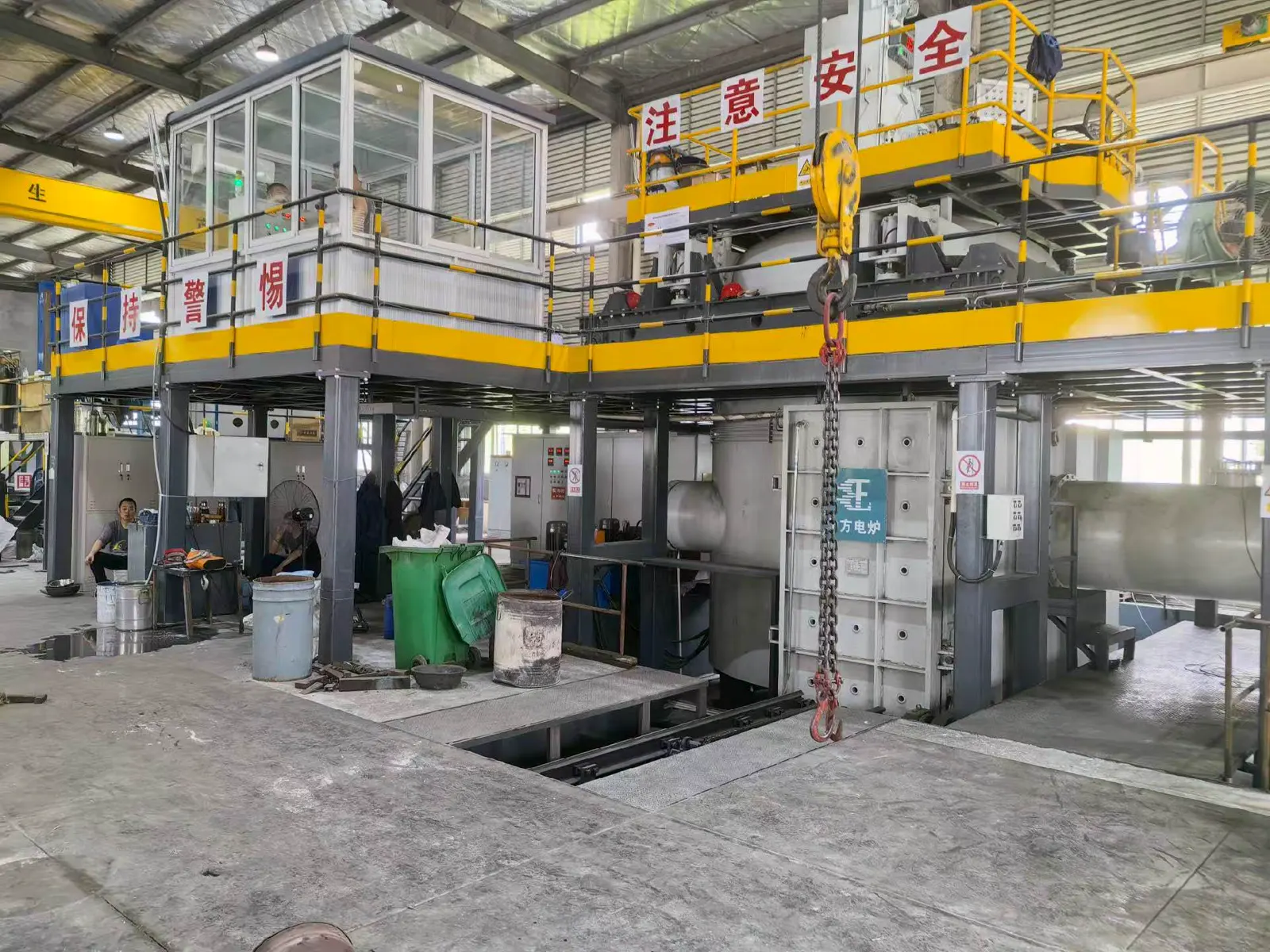 Elevated industrial processing line with crane handling