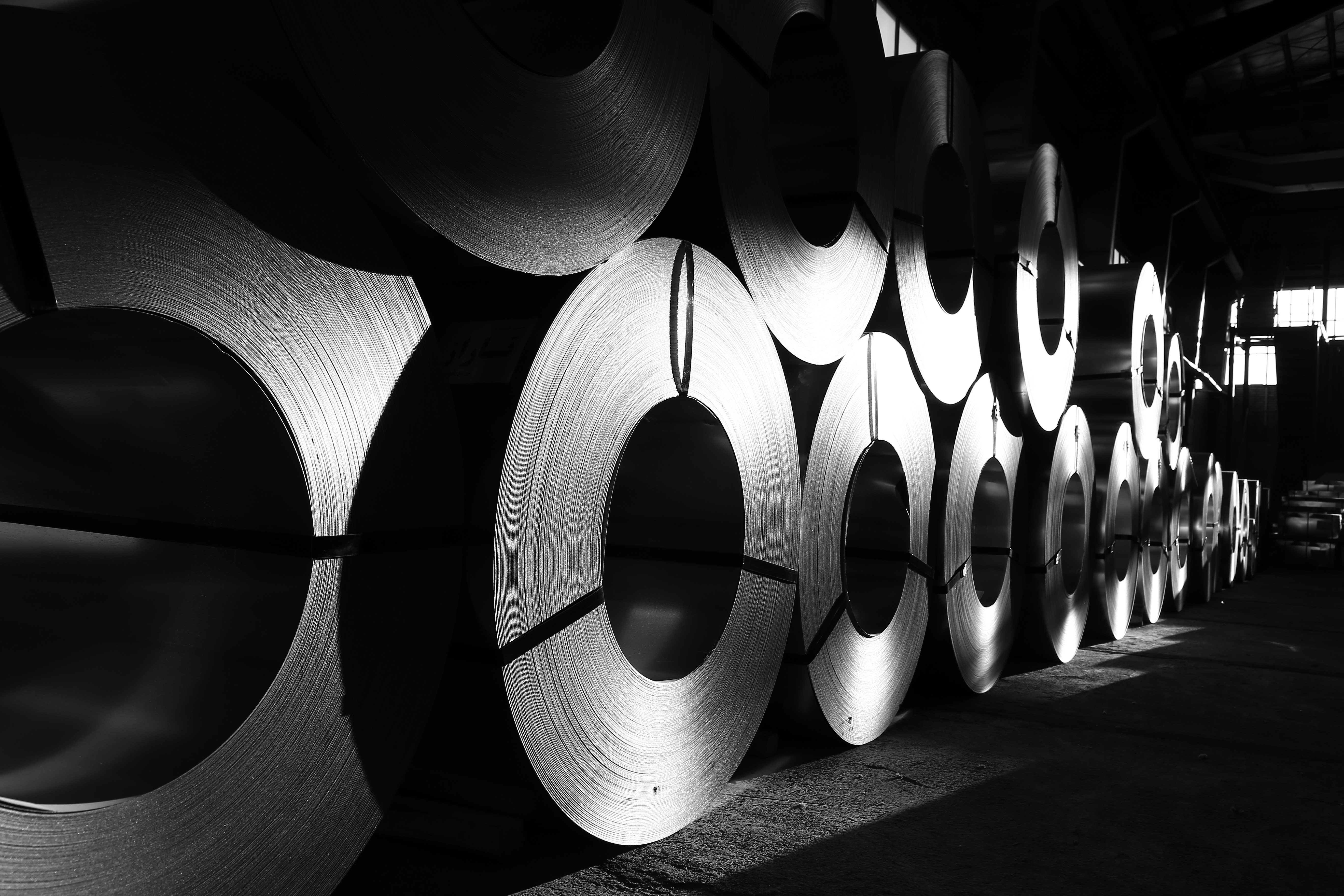 Steel coil raw materials stored in an industrial warehouse