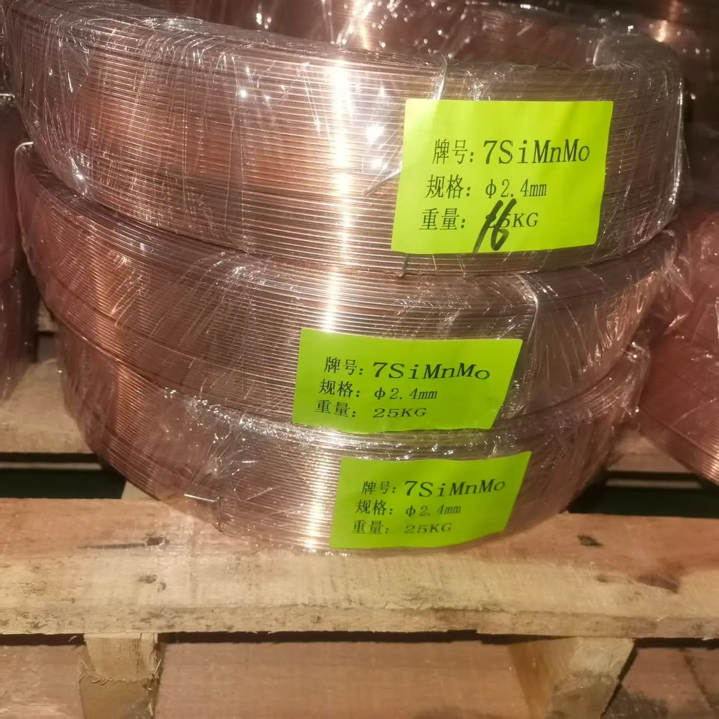 7SiMnMo welding wire coils labeled 2.4 mm