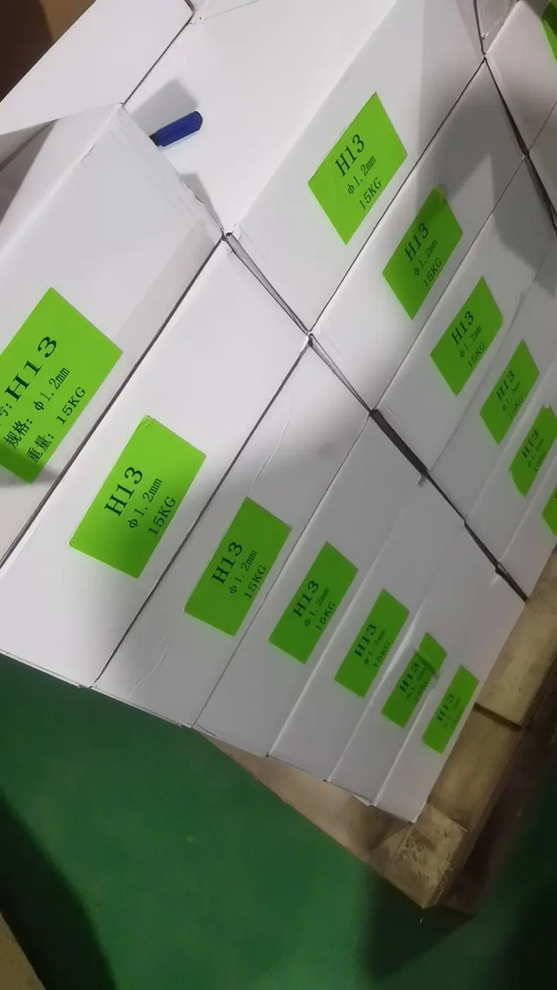 Boxes labeled H13 1.2 mm welding wire