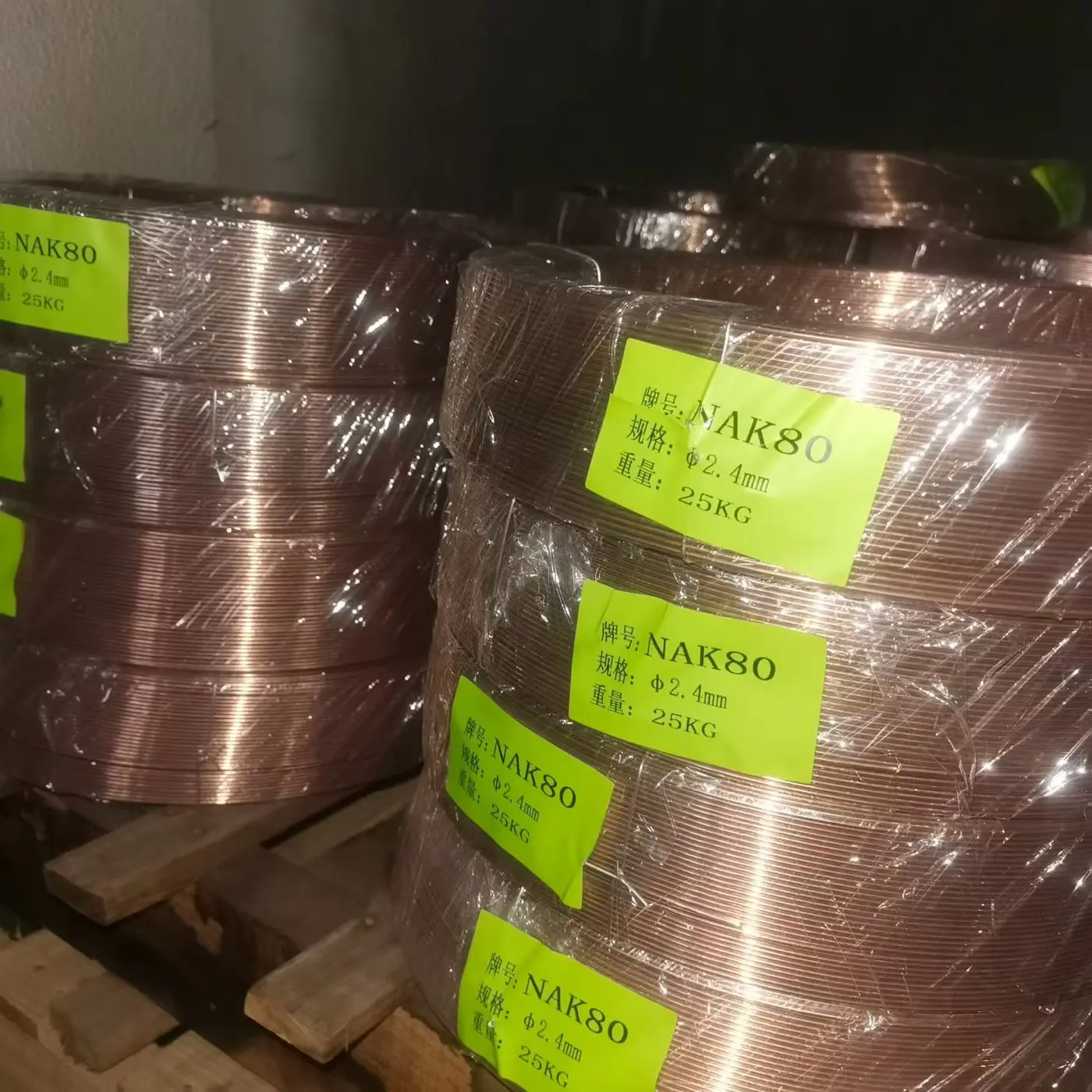 NAK80 welding wire coils labeled 2.4 mm