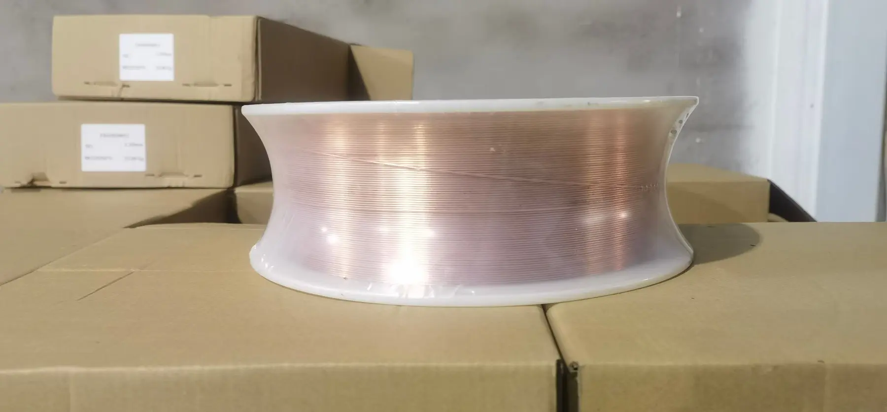 Spooled welding wire protected for storage